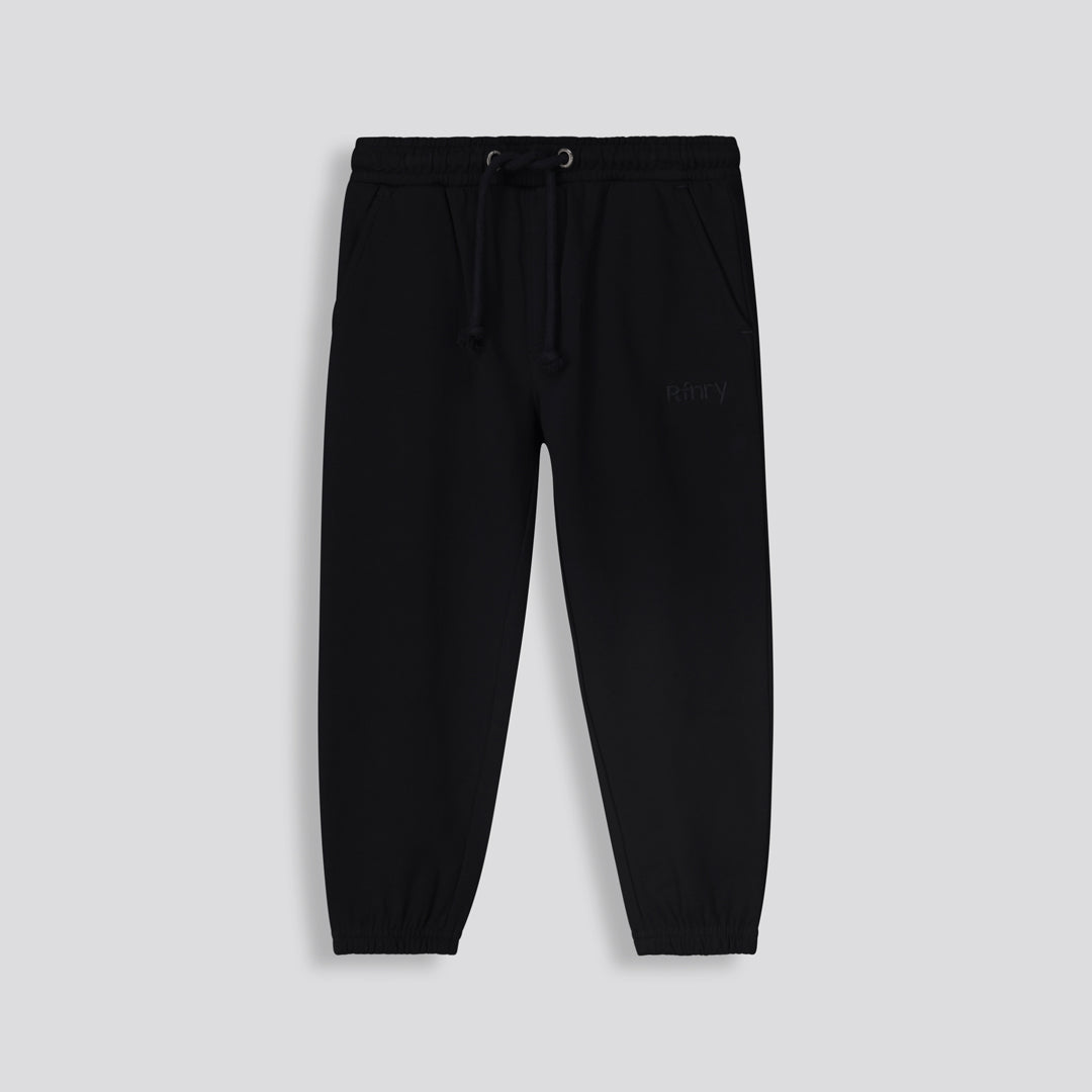 Front View: Plain black track pants with a relaxed kids fit and drawstring waist.