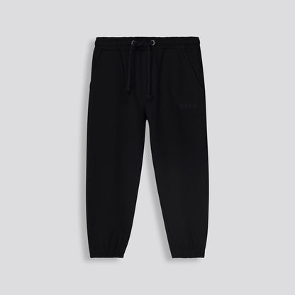 Front View: Plain black track pants with a relaxed kids fit and drawstring waist.