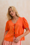 Pintuck Tie-Front Peplum Top